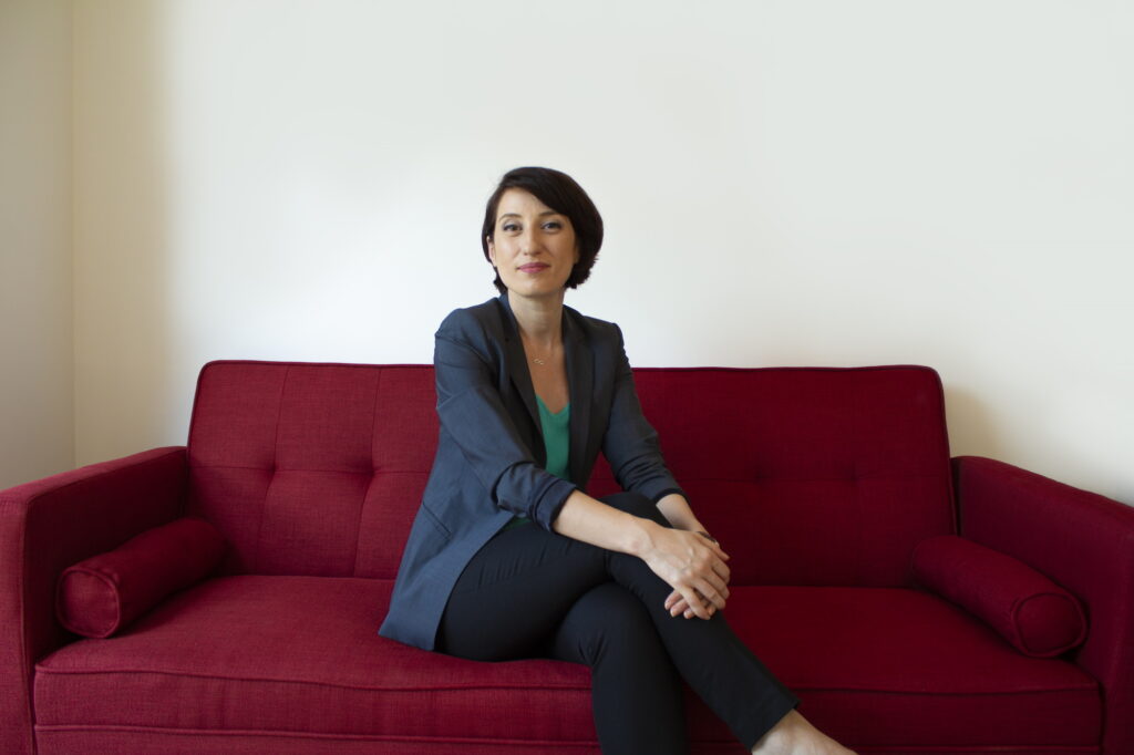 photo of alina Tabusca Bota sitting on a red couch